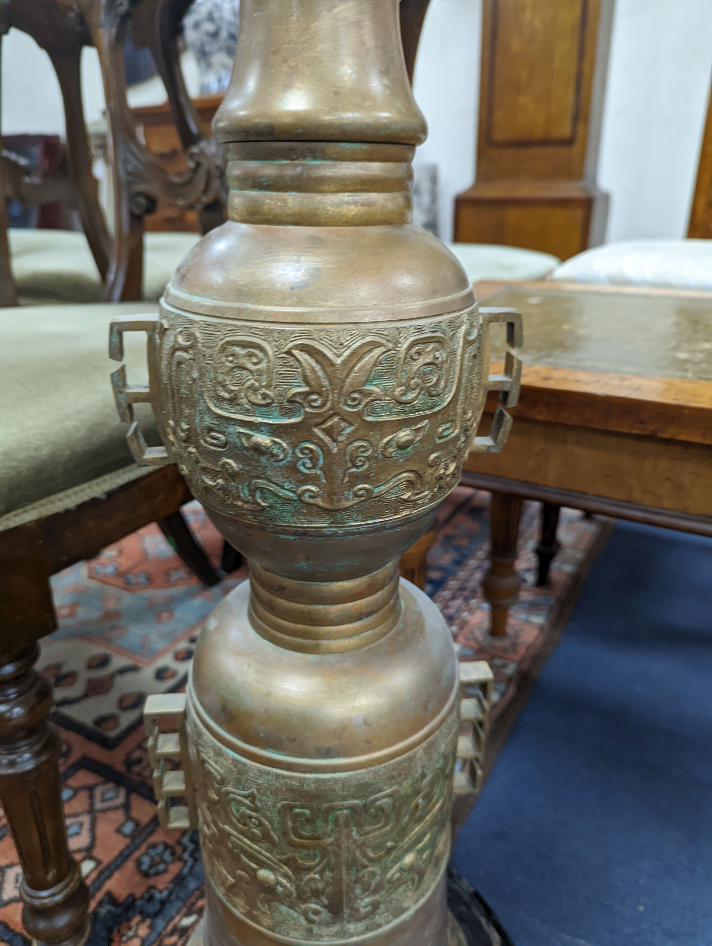 A Chinese bronzed metal floor lamp